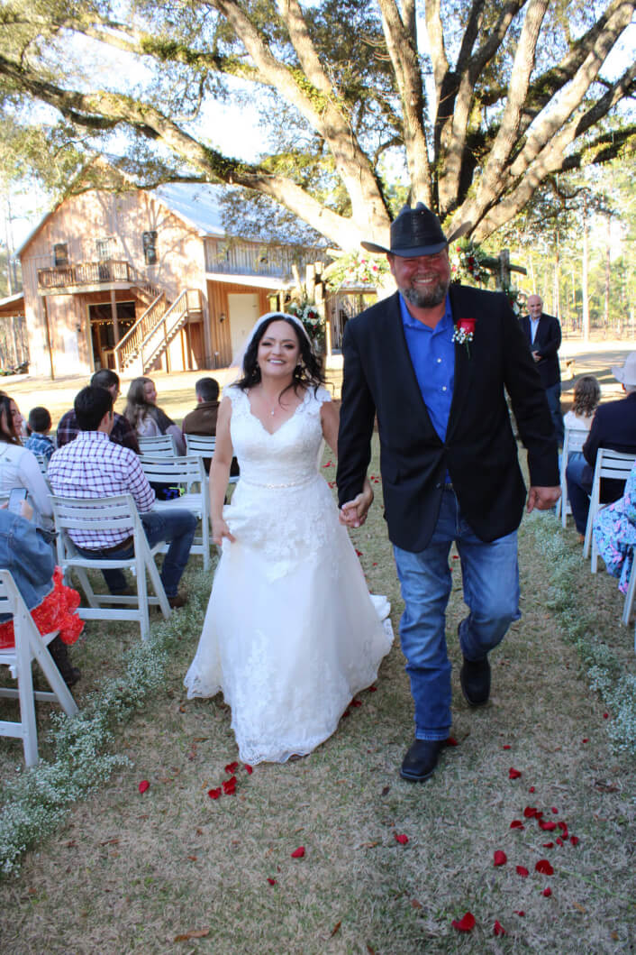 Couple walking down the aisle at Wedding Ceremony